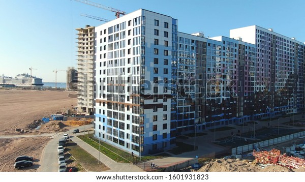 City infrastructure development. Motion. Construction\
of new residential complexes, roads and other infrastructure in\
summer against blue sky