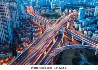 city interchange bridge closeup with beautiful tail lights in nightfall  - Shutterstock ID 184820567
