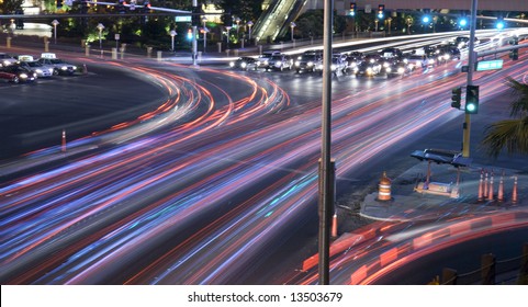 City Intersection Time Lapse With Traffic Seen As Trails Of Light