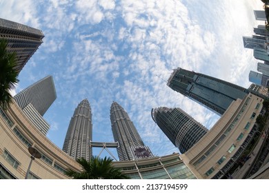 City, Kuala Lumpur, Malaysia - Feb 25 2017: Fish Eye View KLCC Tower In Low Angle Under Blue Sun