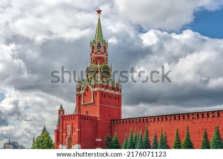 City landscape, Centre of Moscow, view at Spasskaya tower of Moscow Kremlin and wall on Red Square. Clouds sky background. HDR photo.