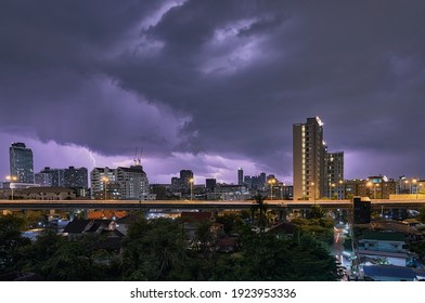 City Landscape Lightning Storm Behind Clouds At Night And Highway Light Trails