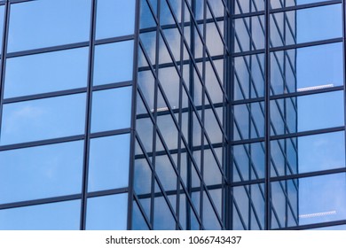 City landscape - view from below on glass skyscrapers with reflected sky in the windows, the city of Rotterdam, the Netherlands