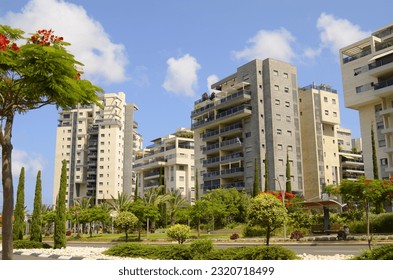 City for life. Beautiful modern urban area. Flowering trees, apartment buildings. Real estate in Israel. Scenic District - Powered by Shutterstock