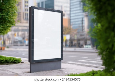 City light billboard mockup on modern city street with buildings in background. Blank white surface for print design promotion. Perfect for advertising showcases