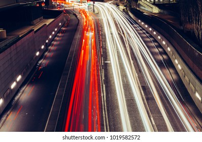 City Light Trails Of Fast Moving Car Traffic On Road In London At Night