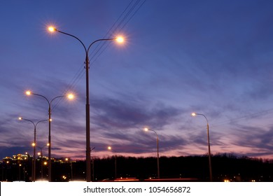 City Lighting Poles Off The Road, Evening Landscape