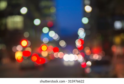 City Lights Blur Background. London, Canary Wharf Night Life. Traffic, Roads, Lanterns And Lit Up Office Buildings