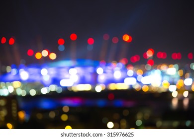 City Lights Blur Background. London, Canary Wharf Night Life. Traffic, Roads, Lanterns And Lit Up Office Buildings