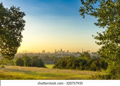 The City of London Cityscape at Sunrise with early Morning Mist from Hampstead Heath. Buildings include the Shard, Gherkin 30 St Mary Axe, St Pauls, Lloyds Building, Stock Exchange and Walkie Talkie.
