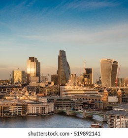 City Of London At Dusk. Landmark Skyscrapers In The Financial District Of The UK Capital With The River Thames In The Foreground.