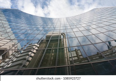 CITY OF LONDON, LONDON-SEPTEMBER 7,2017: Reflection of the Lloyds building in high-tech architectural style in facade of the Willis building on September 7, 2017 in London. 