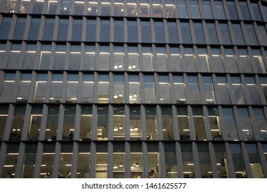 City Of London, UK - February 2019: Repeated Offices Of A Building, At The Same Size. Picture Of Employees During Their Duty.