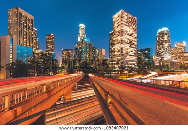 City\
of Los Angeles California at night with light\
trails