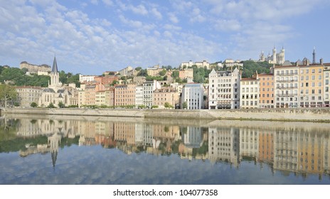 City of Lyon reflected in river saone, France