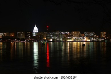 City of Madison, the capital city of Wisconsin, Midwest USA . Madison downtown skyline at winter night with official buildings, Monona Terrace and capitol dome, glowing in the dark. 