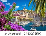 City of Marseille harbor and Notre Dame de la Garde church on the hill flower and palm view, southern France