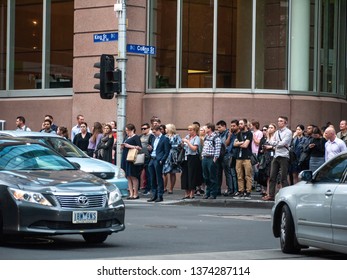 City Of Melbourne, VIC/Australia-April 15th 2019: Crowds Of People Waiting For Green Light To Cross During After-work Rush Hour In CBD.