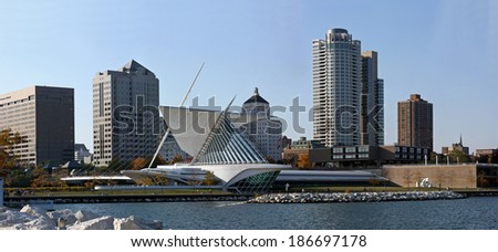 City of Milwaukee Wisconsin skyline circa 2014 from Lake Michigan, in the late Summer. Trees are starting to turn to Fall colors.