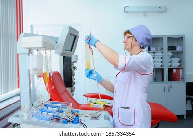 At The City (municipal) Blood Transfusion Station. Nurse Preparing Apparatus Separator For Blood Transfusion. April 5, 2019. Kiev, Ukraine