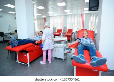 At The City (municipal) Blood Transfusion Station. Nurse Preparing Apparatus Separator For Blood Transfusion, Donors Lying In Hospital Beds. April 5, 2019. Kiev, Ukraine