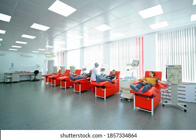 At The City (municipal) Blood Transfusion Station. Nurse Preparing Apparatus Separator For Blood Transfusion, Donors Lying In Hospital Beds. April 5, 2019. Kiev, Ukraine