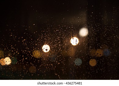 City Night Lights. Rainy Window In The City