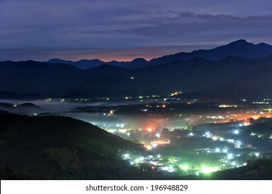 A City At Night Looking Down From The Mountains.