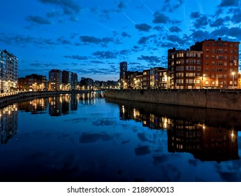 Liège City With Night Sky Reflection On The Meuse