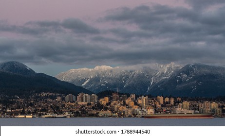 City of North Vancouver surrounded by snowed mountains in winter 