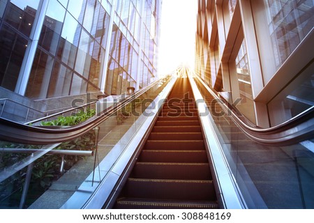 City outdoor escalator under the sun