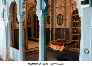 City Palace, Udaipur, Rajasthan, India - January 2019 : A Dressed Up Vintage Royal Swing Inside The Blue Room. No People.