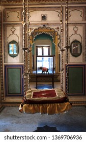 City Palace, Udaipur, Rajasthan, India - January 2019 : A Dressed Up Vintage Royal Swing Inside The Blue Room. No People.