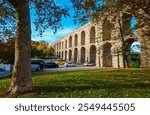 city park next to the Valens aqueduct, with a green lawn and trees, ancient architecture of Istanbul, Turkey