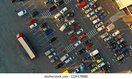 City parking lot with cars and big truck. Aerial. View above. - Shutterstock ID 1229178880