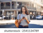 City, reading and woman with cellphone for chat, text message or networking with online contact. Outdoor, female person or happy traveler with smartphone for mobile app, communication or social media