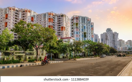 City Residential Multi Storey Apartments With Adjacent Road At Sunrise. Photograph Shot At Rajarhat Area Of Kolkata, India.