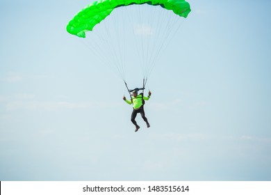 City Riga, Latvian Republic. Avio Show In Honor Of The City Festival. Parachutists Land With Parachutes On Target. 17 August 2019.