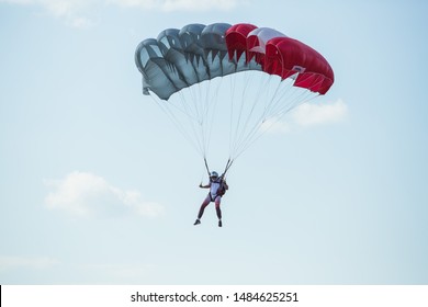 City Riga, Latvian Republic. Avio Show In Honor Of The City Festival. Parachutists Land With Parachutes On Target. 17 August 2019.