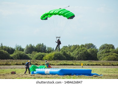 City Riga, Latvian Republic. Avio Show In Honor Of The City Festival. Parachutists Land With Parachutes On Target. 17 August 2019.