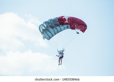 City Riga, Latvian Republic. Avio Show In Honor Of The City Festival. Parachutists Land With Parachutes On Target. 17 August 2019.