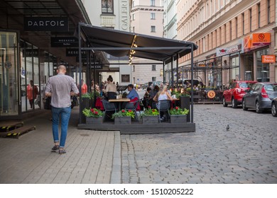 City Riga, Latvian Republic. Outdoor cafe and people sitting on the terrace. 2019. 11. Jun.