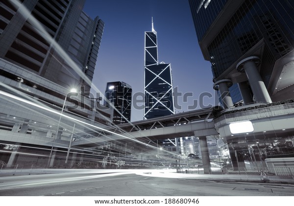 City road light trails of streetscape buildings\
backgrounds in HongKong