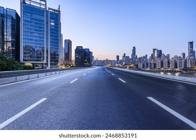 City road with modern buildings scenery at night in Chongqing - Powered by Shutterstock