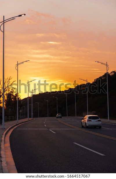 The city road in the\
setting sun.