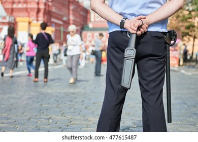 City Safety. Policeman In The Street With Metal Detector Wand