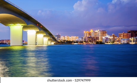 City of Sarasota, Florida across elevated bridge and bay at night