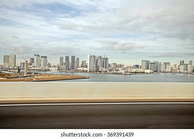 City Scape Of Japan - Modern City, Skyscrapers, And Bay On Highway View (bus Window) 
