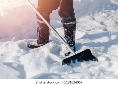 City Service Cleaning Snow Winter With Shovel After Snowstorm Yard. Sunlight