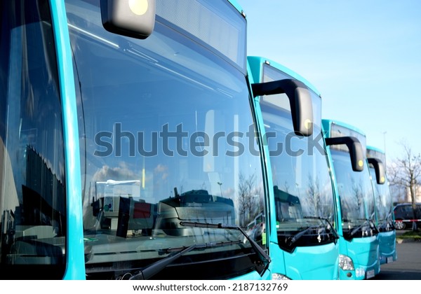 city\
shuttle buses rank at Frankfurt bus station in Germany, green\
vehicle public transport concept, transport companies strike,\
transport facilities for people in all\
localities